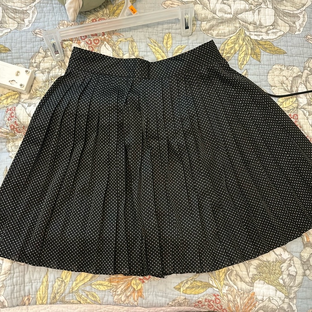 Short black ruffled skirt
